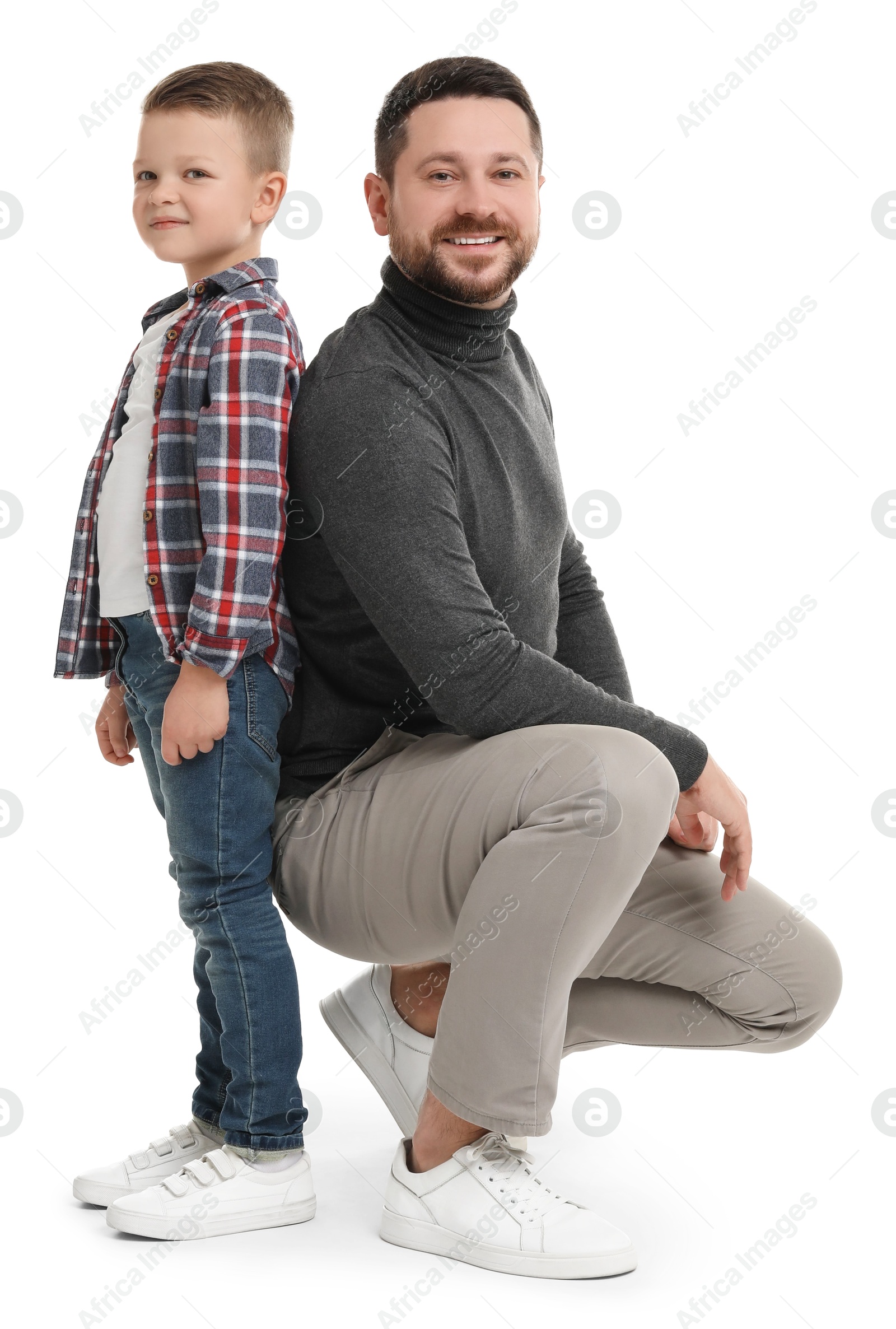 Photo of Happy father with his cute little son on white background