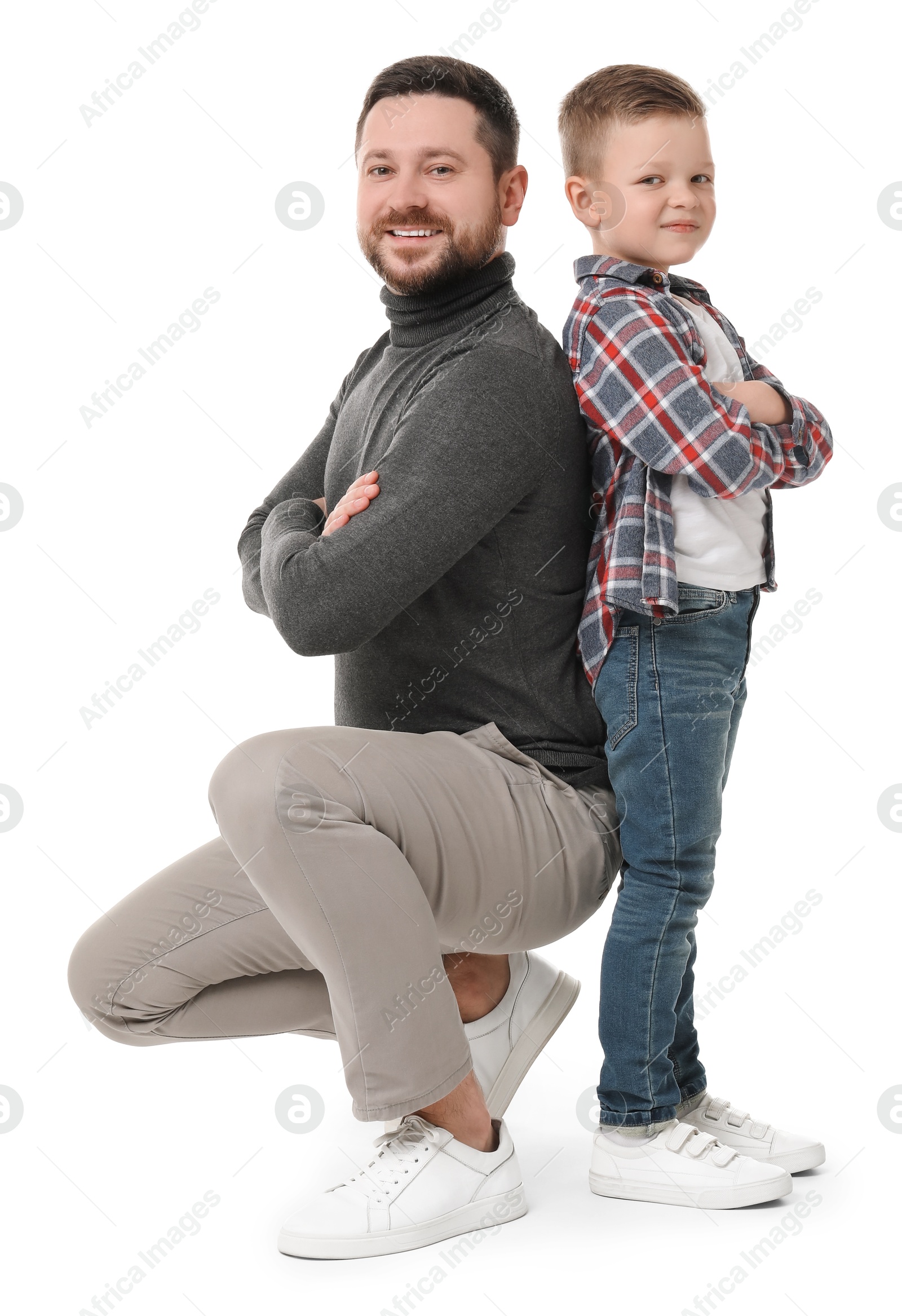 Photo of Happy father with his cute little son on white background