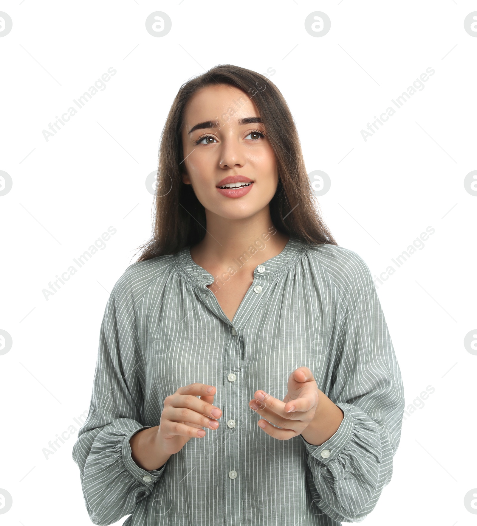 Photo of Young woman in casual clothes talking on white background