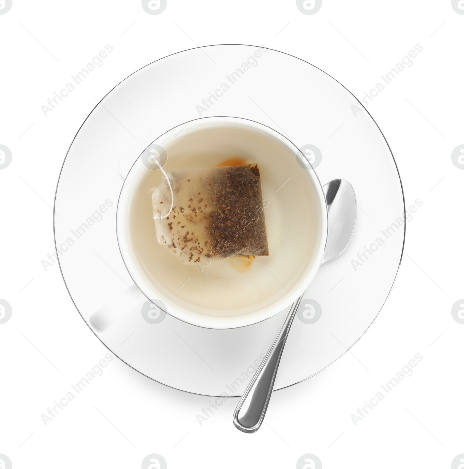 Photo of Tea bag in cup with hot drink isolated on white, top view