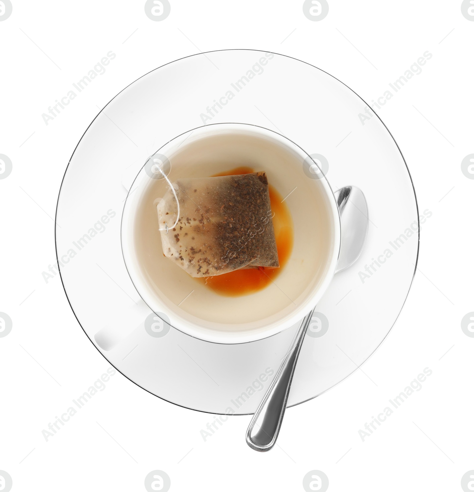 Photo of Tea bag in cup with hot drink isolated on white, top view