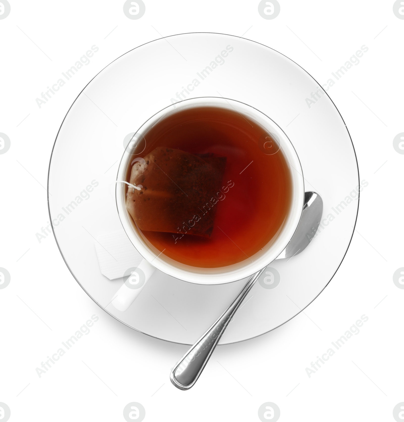 Photo of Tea bag in cup with hot drink isolated on white, top view