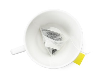 Photo of Tea bag in cup isolated on white, top view