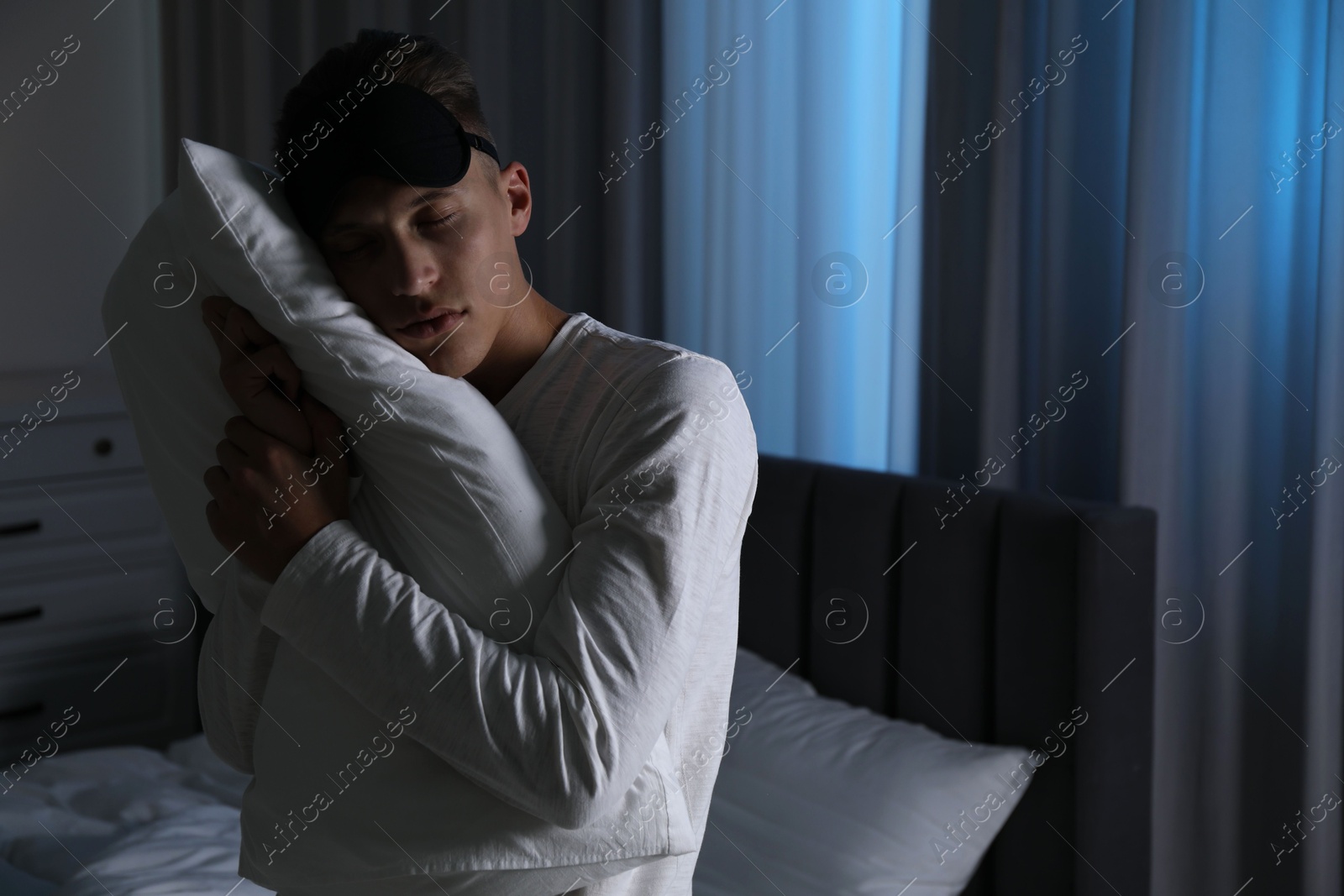 Photo of Young man suffering from sleepwalking at home