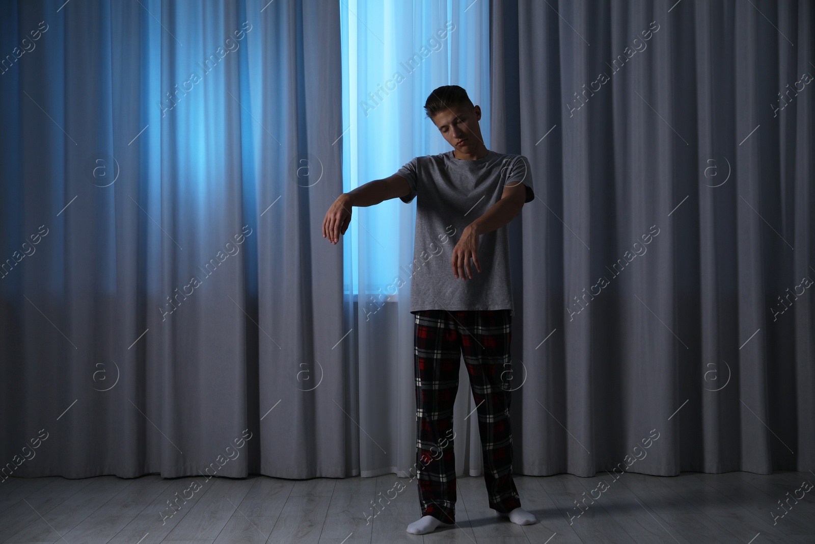 Photo of Young man suffering from sleepwalking at home