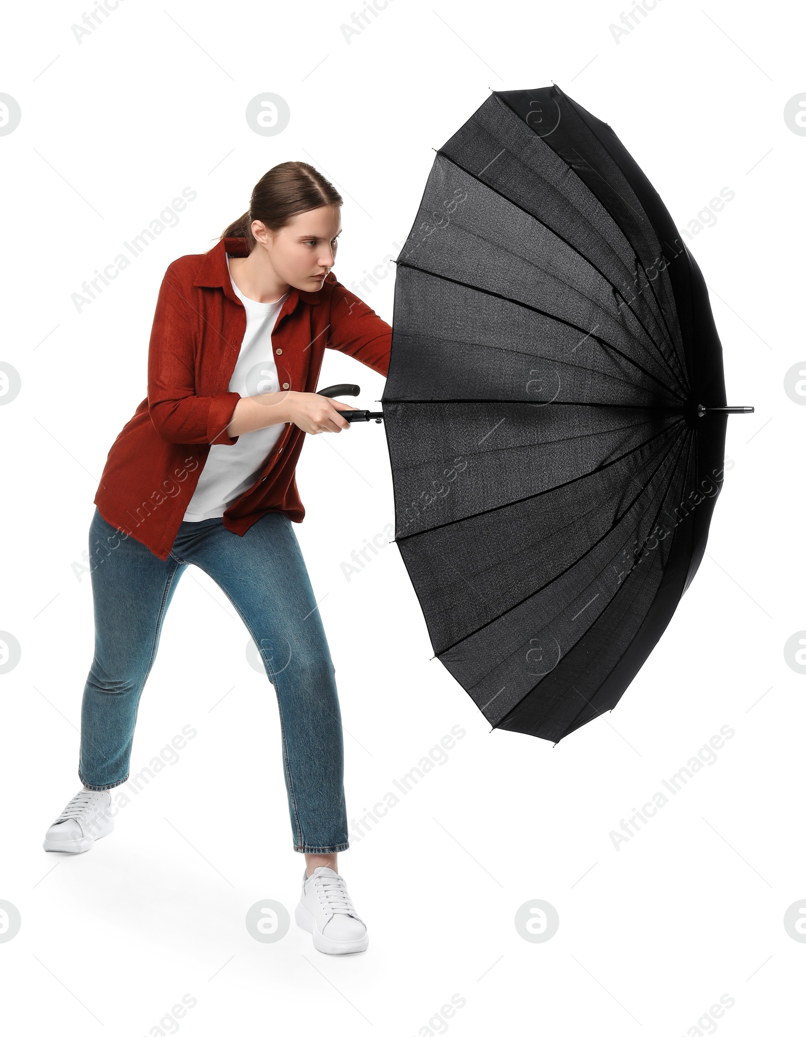 Photo of Young woman with black umbrella on white background