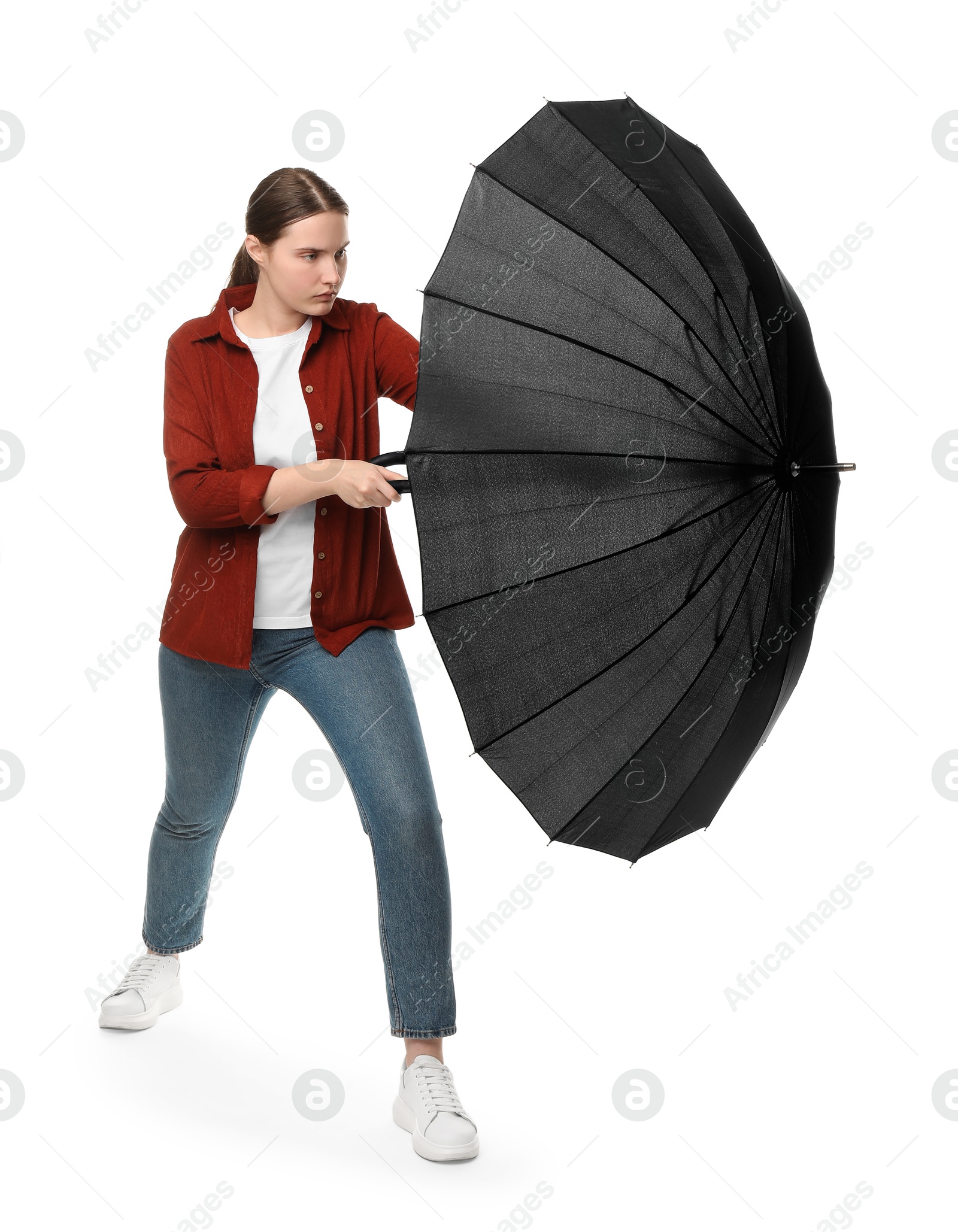 Photo of Young woman with black umbrella on white background