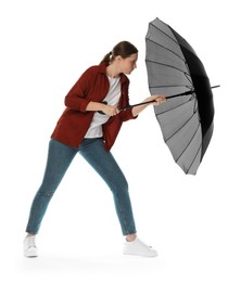 Photo of Young woman with black umbrella on white background