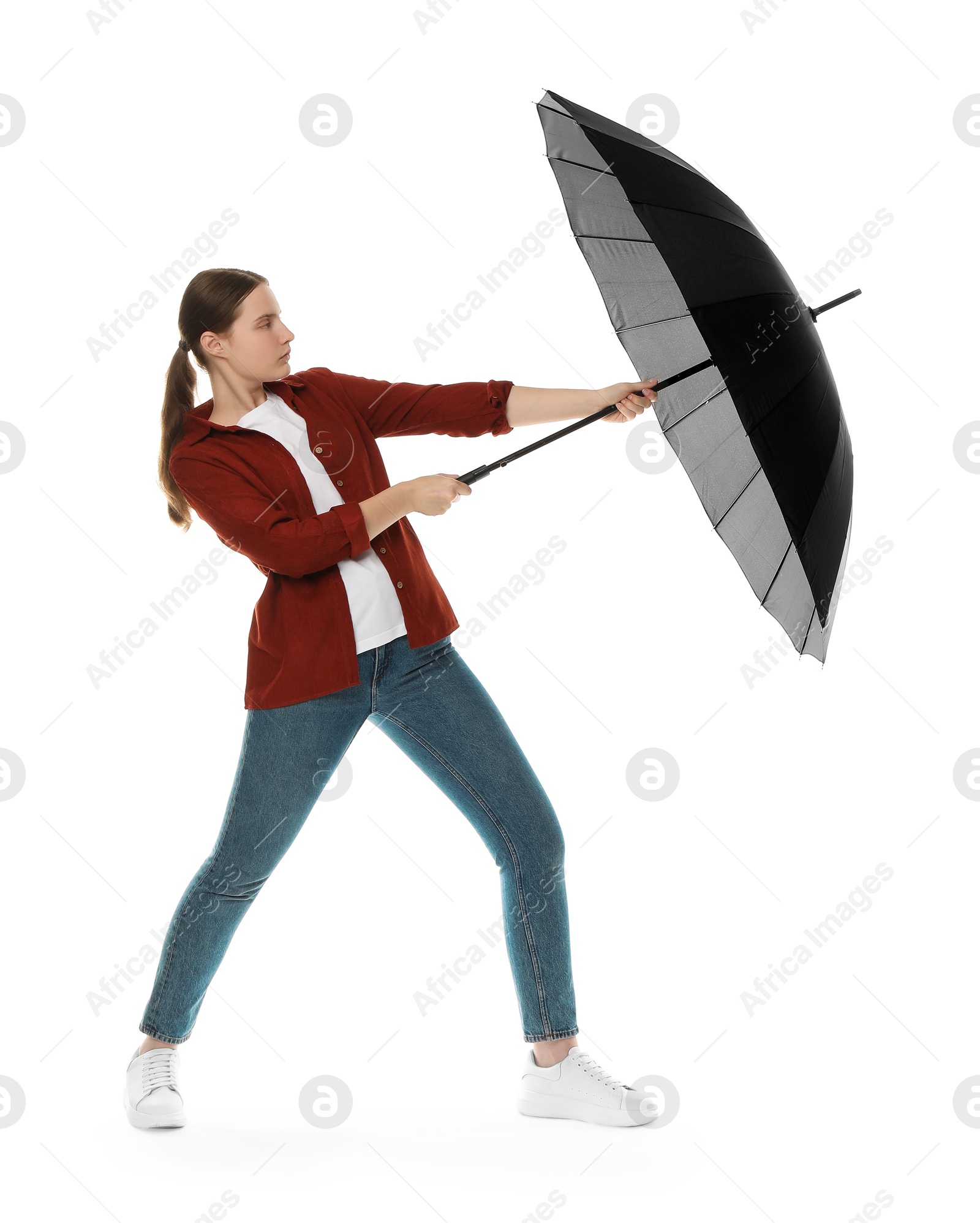 Photo of Young woman with black umbrella on white background