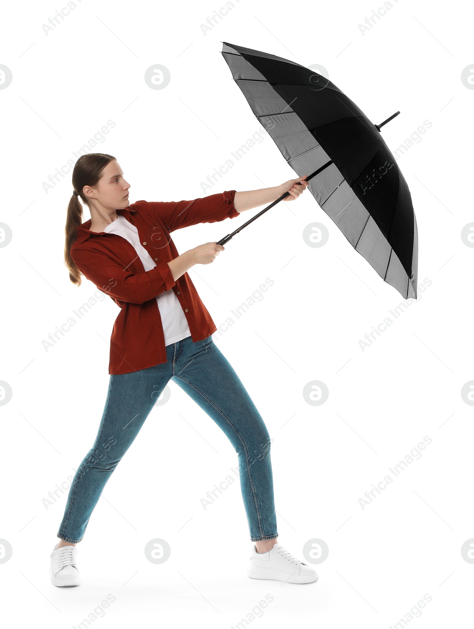 Photo of Young woman with black umbrella on white background