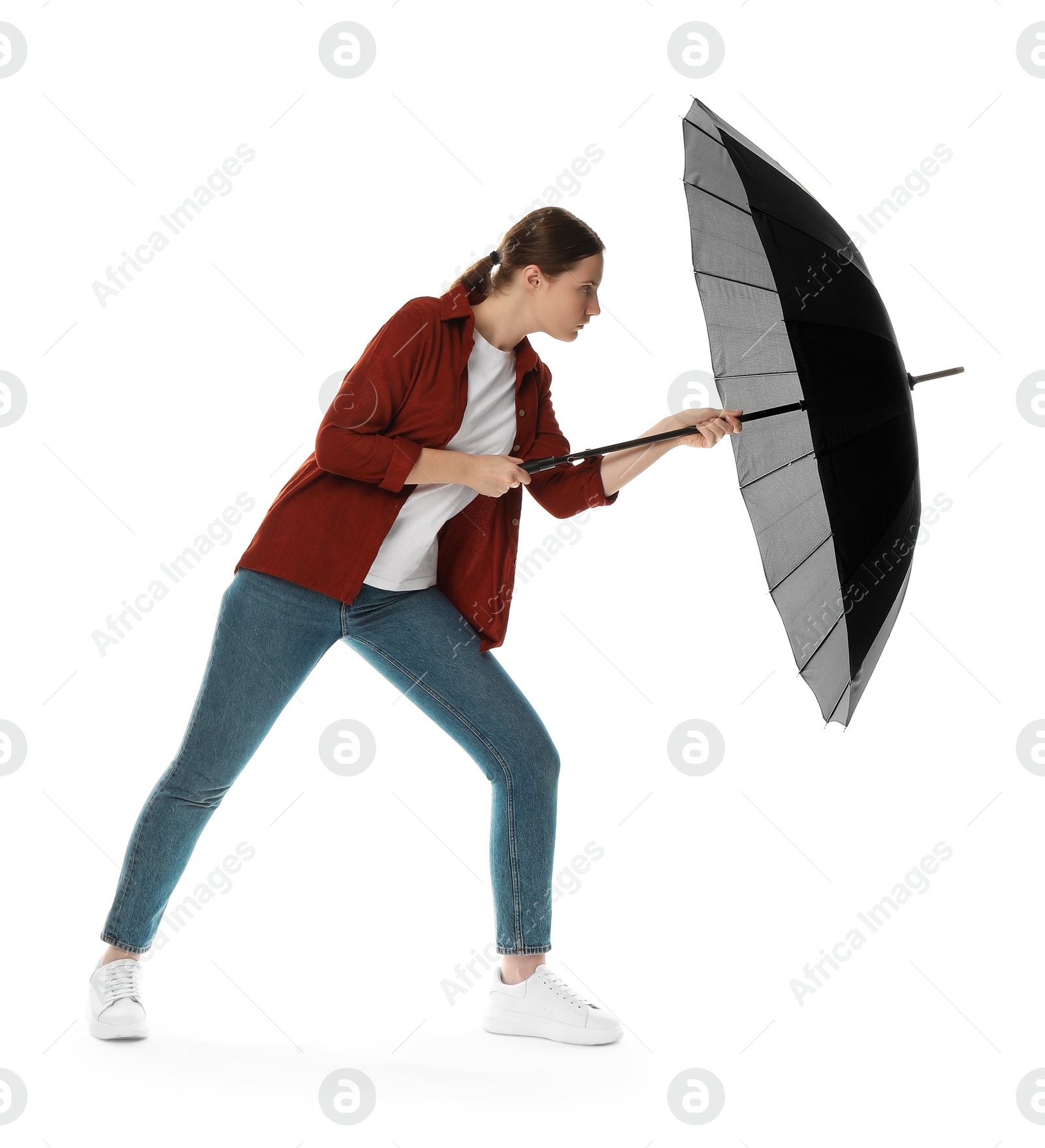 Photo of Young woman with black umbrella on white background