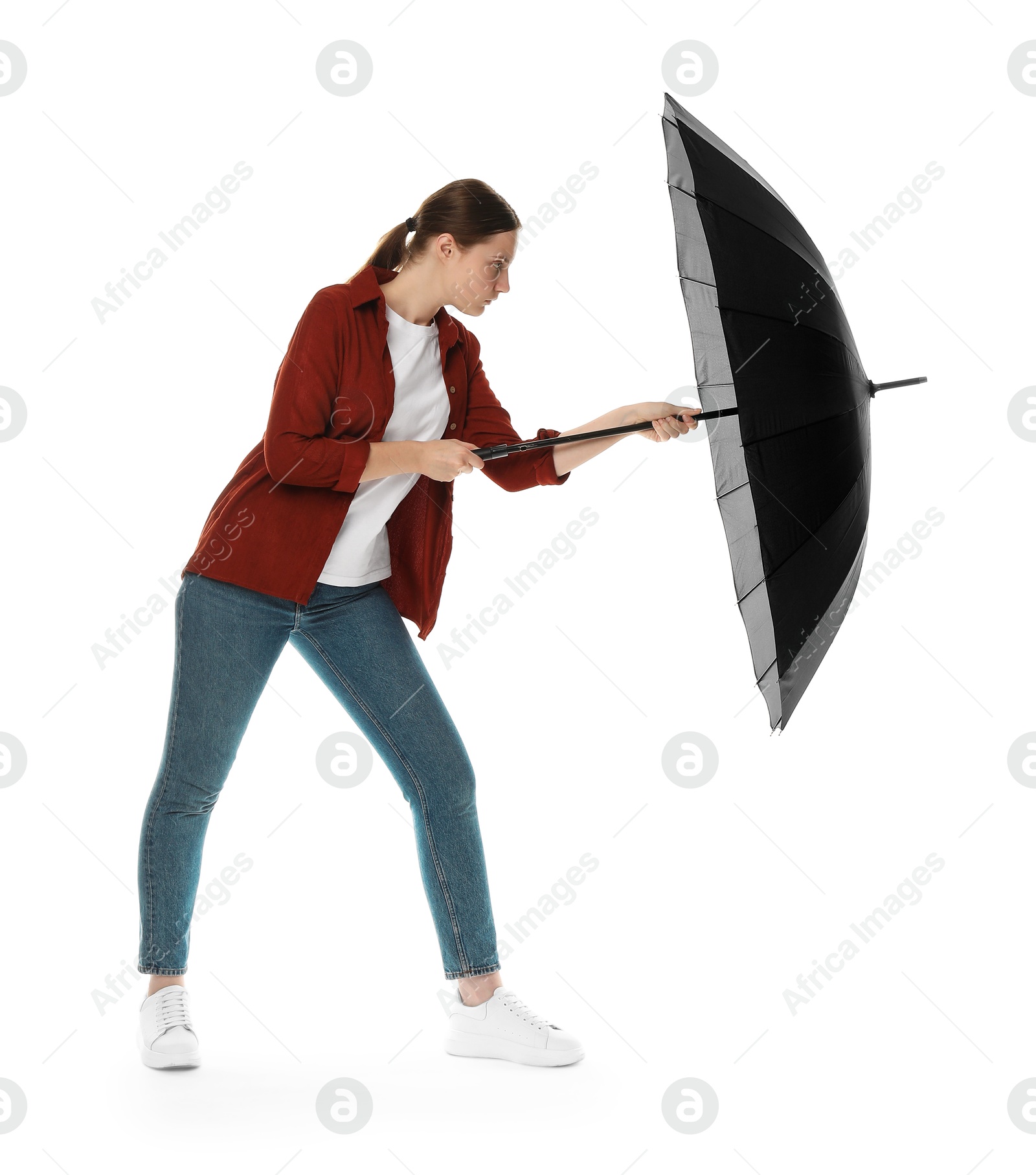 Photo of Young woman with black umbrella on white background