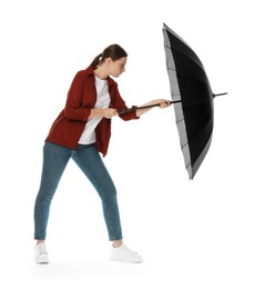 Photo of Young woman with black umbrella on white background