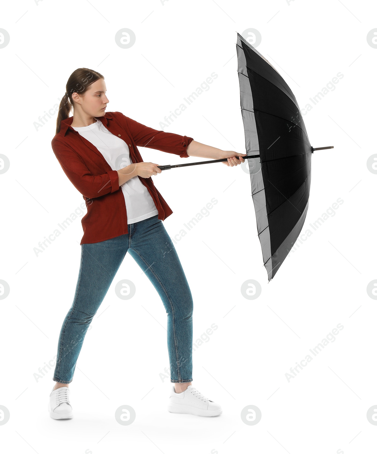 Photo of Young woman with black umbrella on white background