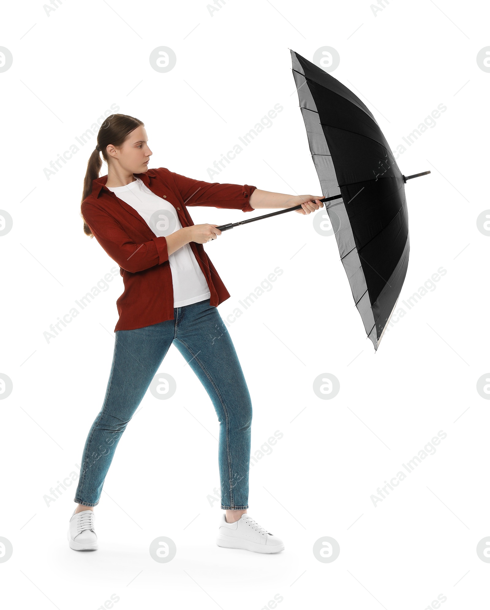 Photo of Young woman with black umbrella on white background