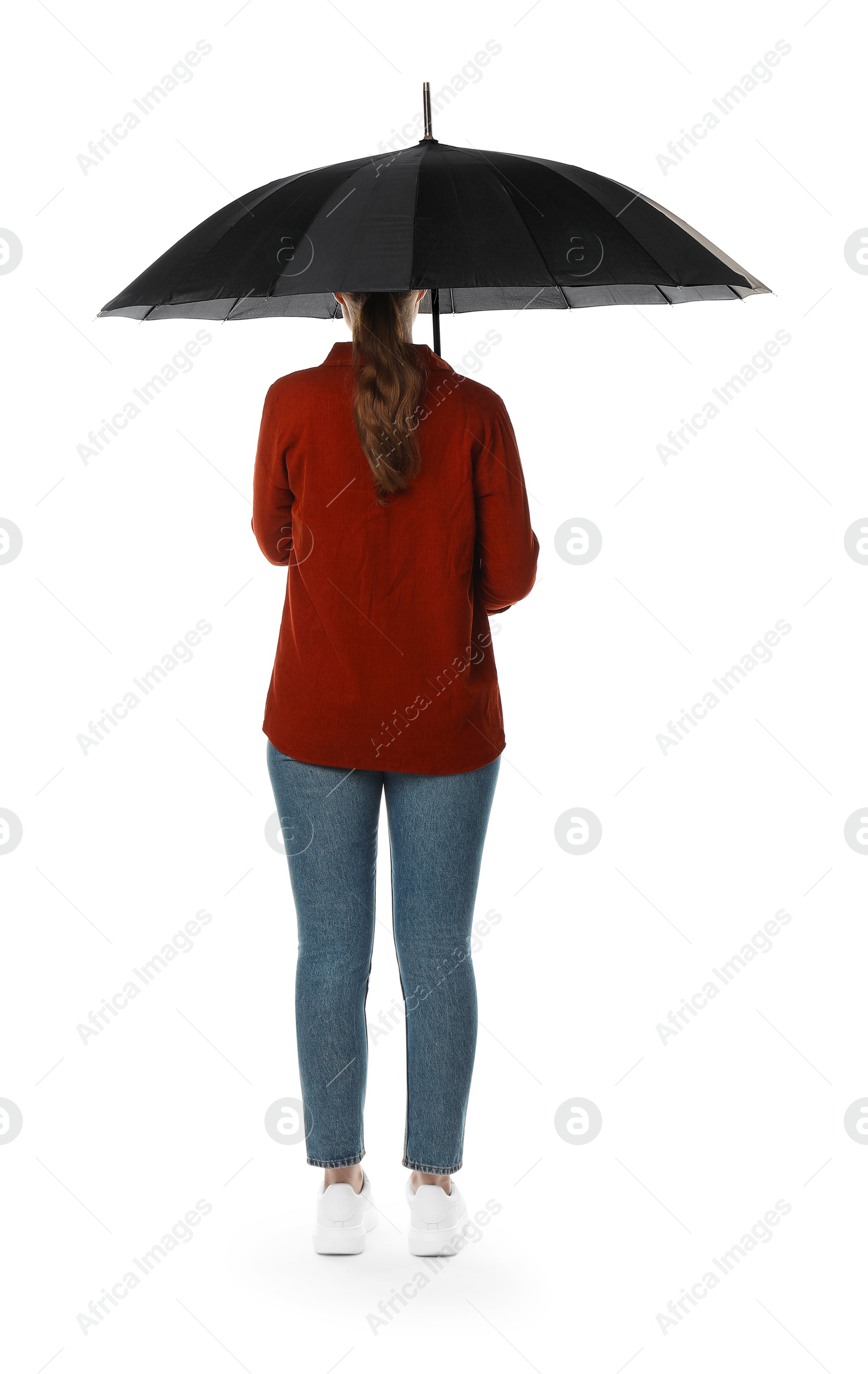 Photo of Young woman with black umbrella on white background, back view