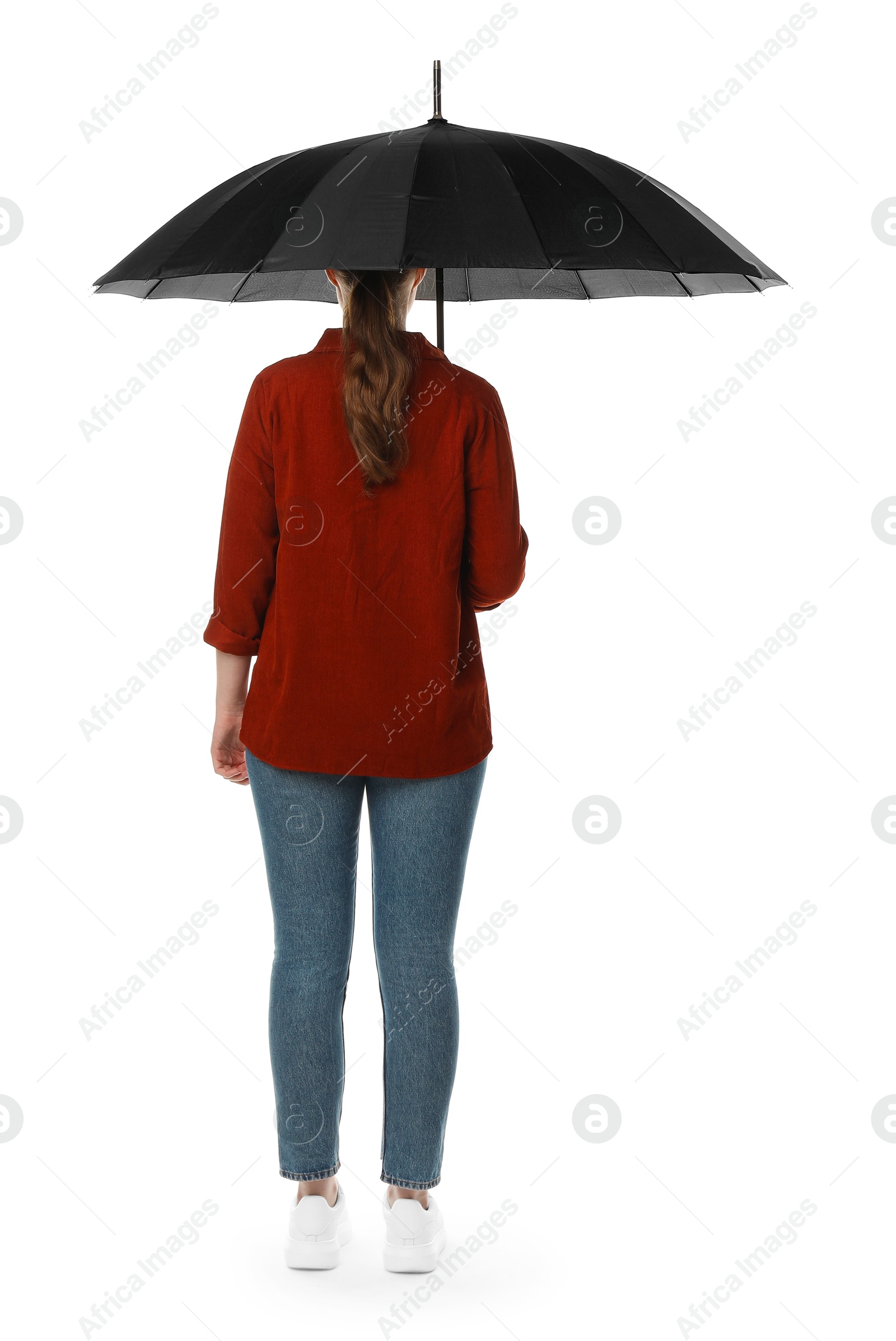 Photo of Young woman with black umbrella on white background, back view