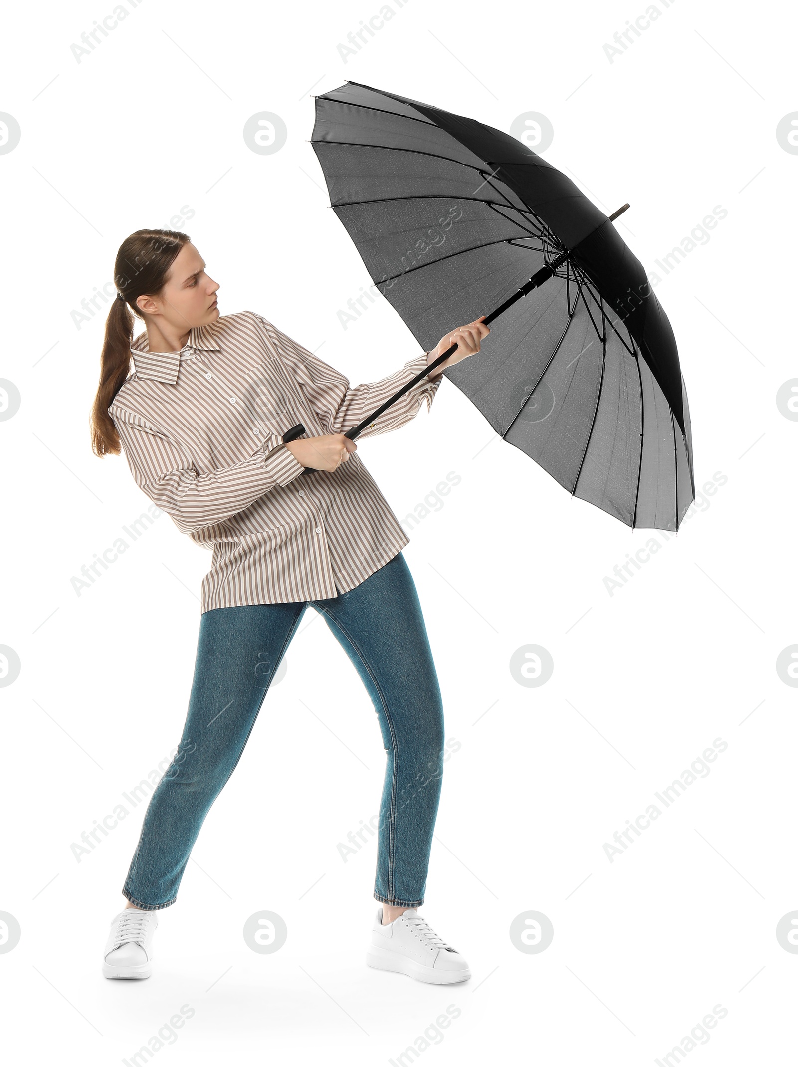 Photo of Young woman with black umbrella on white background