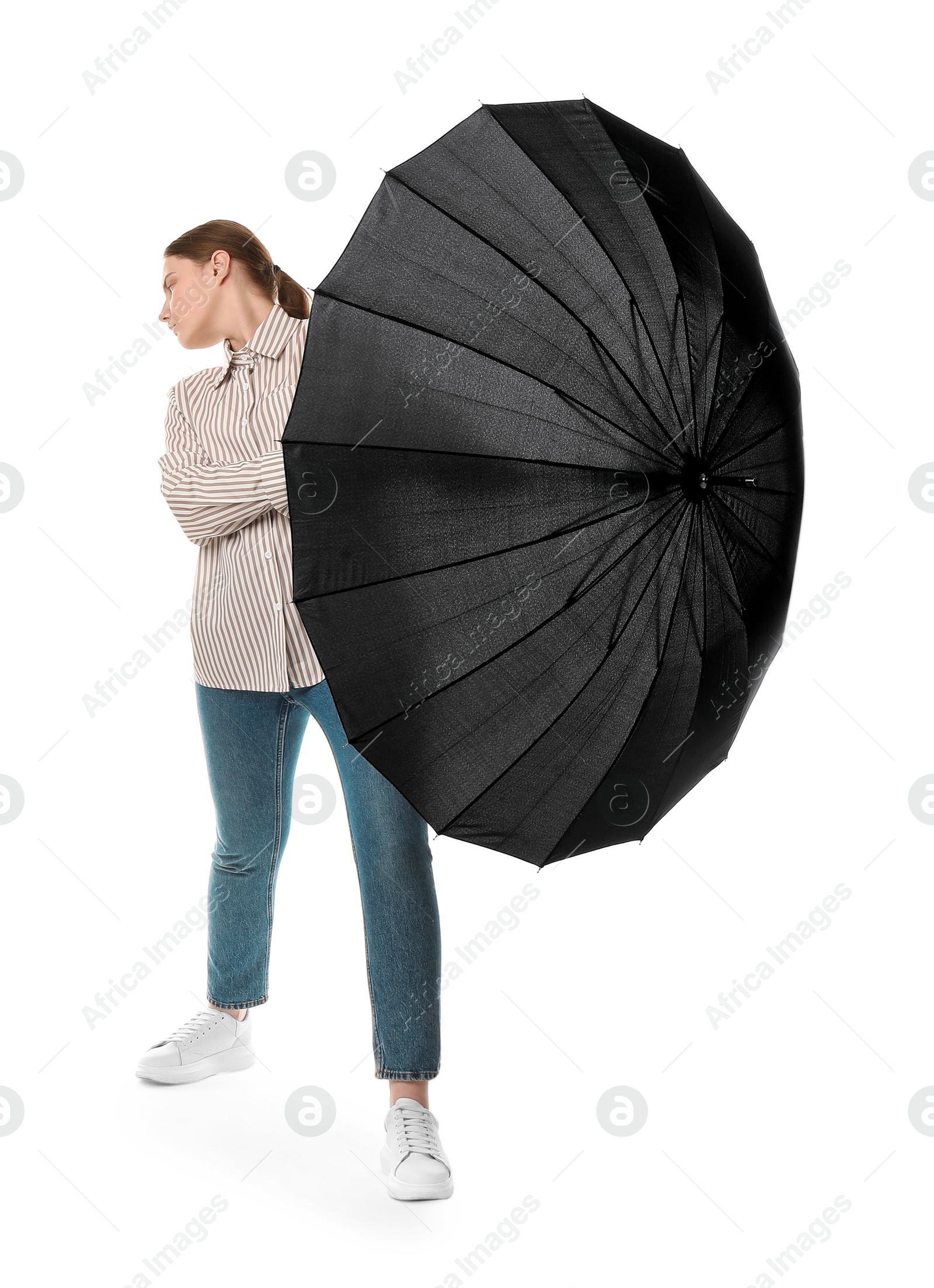 Photo of Young woman with black umbrella on white background