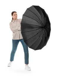 Photo of Young woman with black umbrella on white background