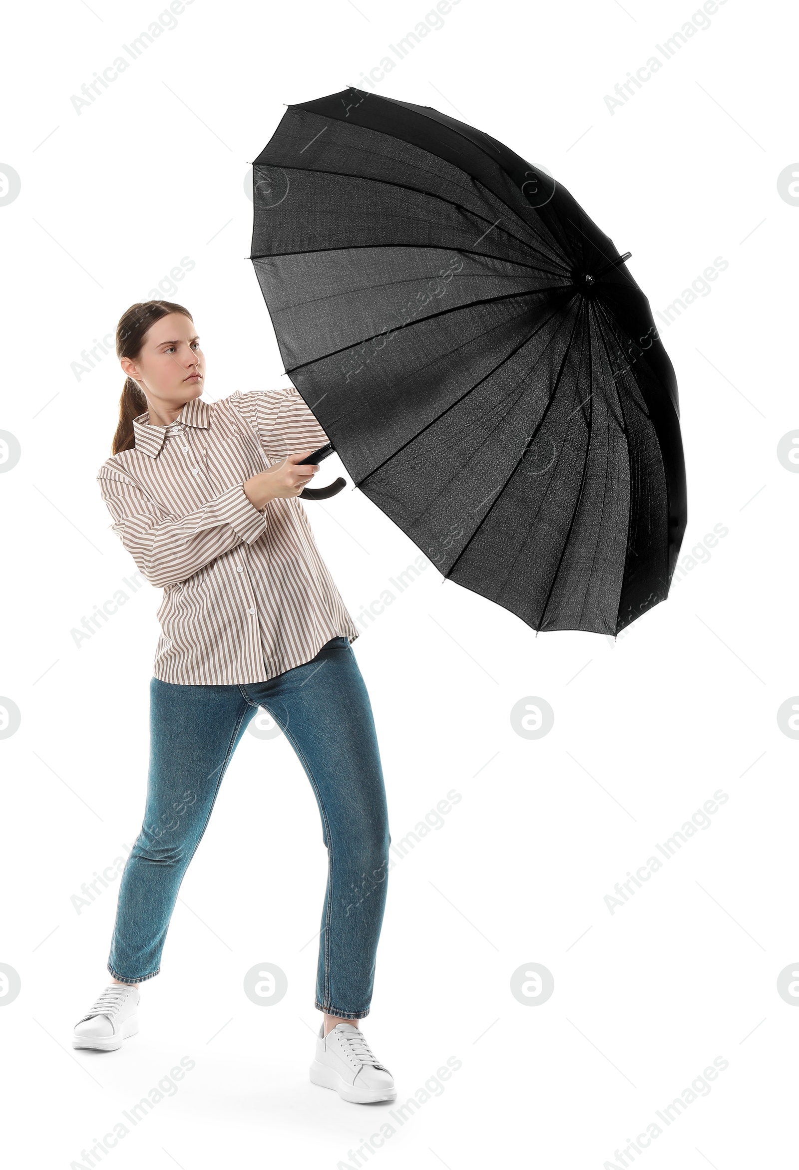 Photo of Young woman with black umbrella on white background