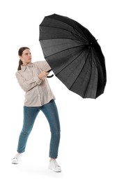 Photo of Young woman with black umbrella on white background