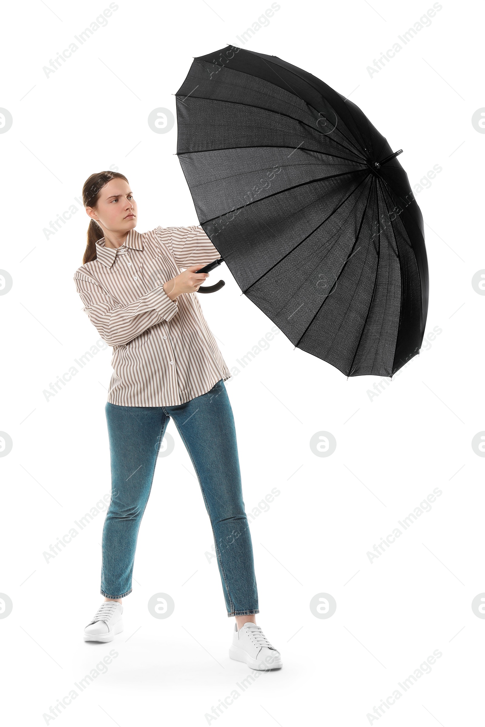 Photo of Young woman with black umbrella on white background