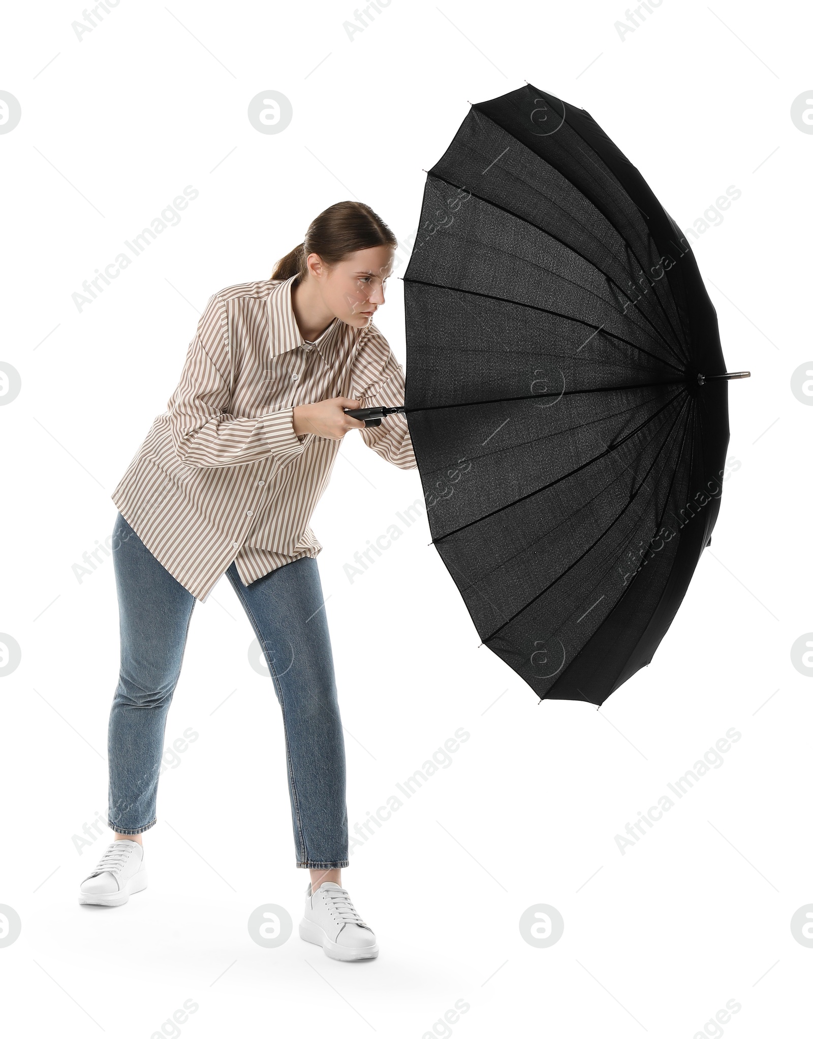 Photo of Young woman with black umbrella on white background