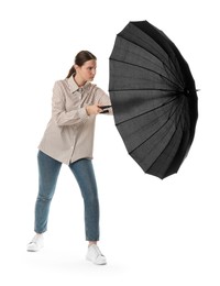 Photo of Young woman with black umbrella on white background