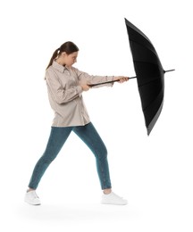 Photo of Young woman with black umbrella on white background