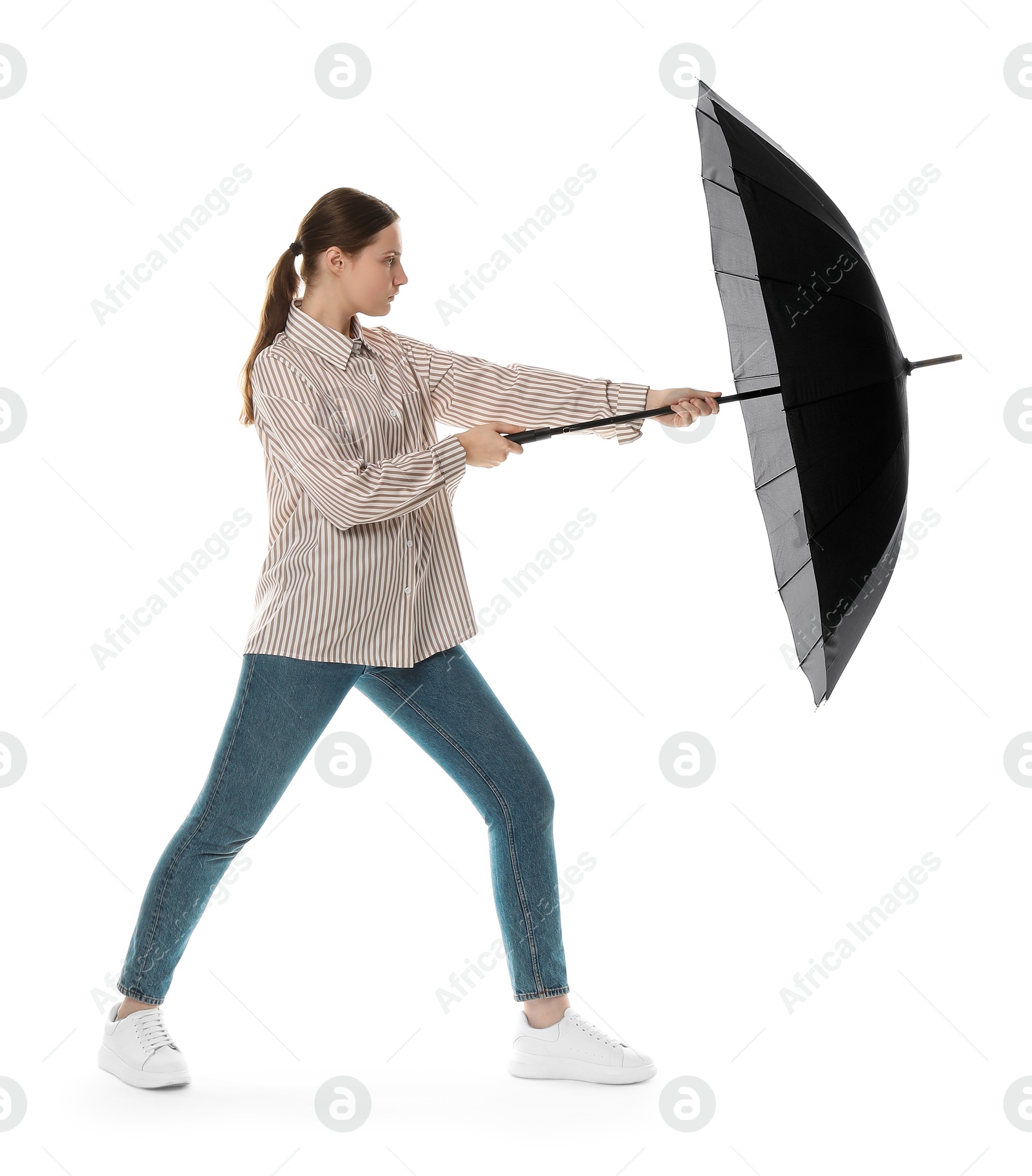 Photo of Young woman with black umbrella on white background