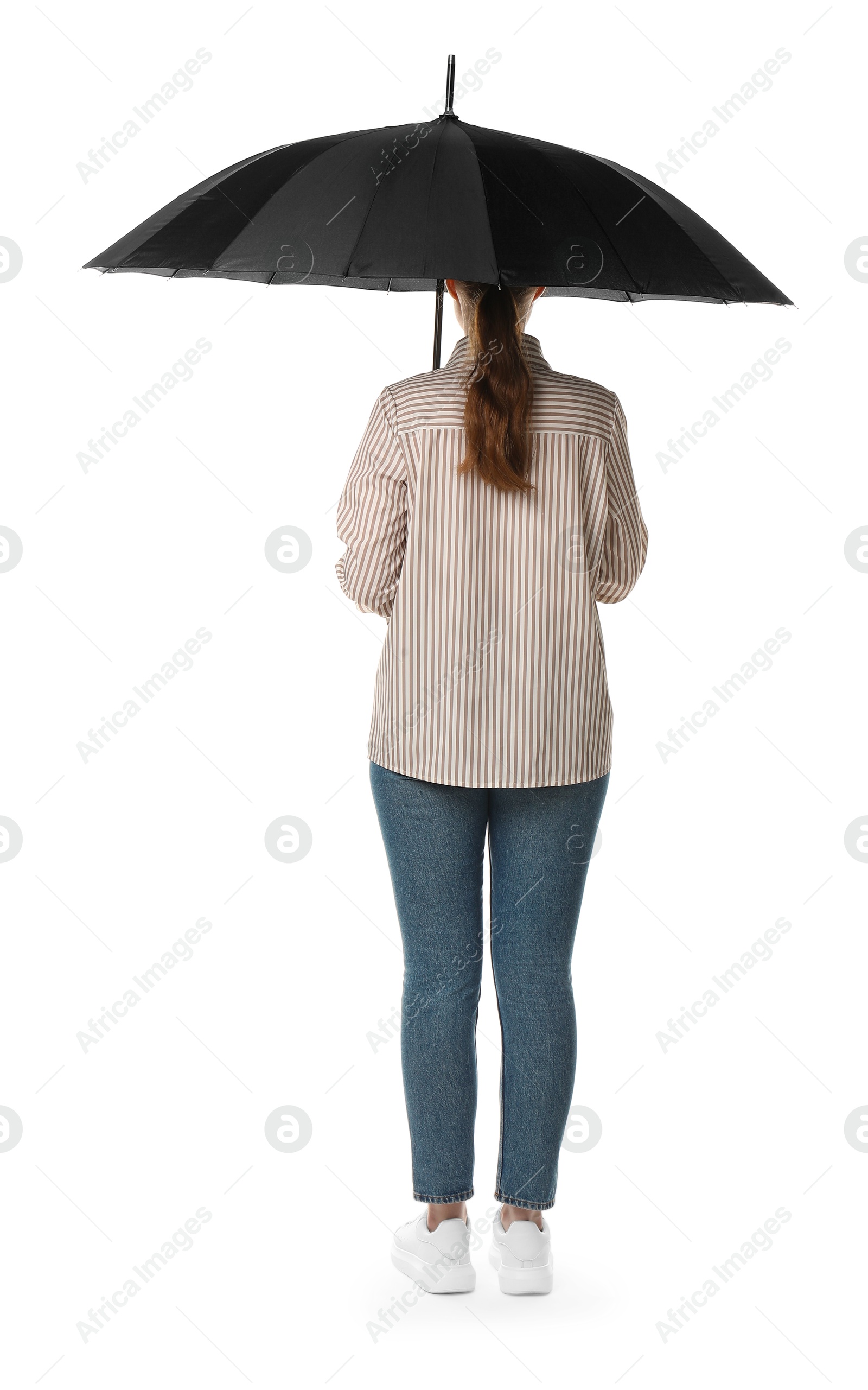 Photo of Young woman with black umbrella on white background, back view