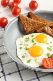 Photo of Tasty fried eggs with toasts served on table, closeup