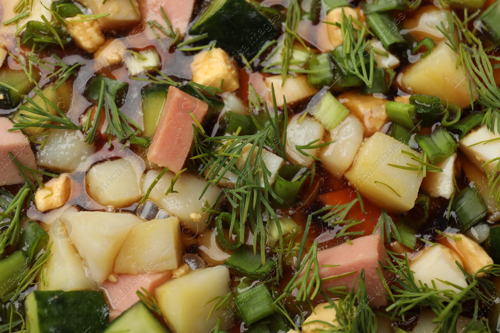 Photo of Tasty okroshka soup with kvass as background, top view