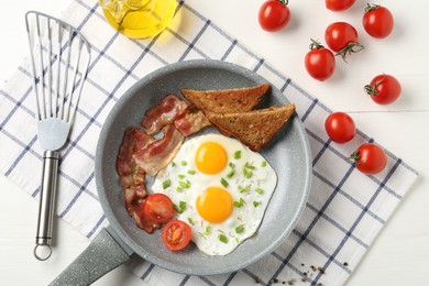 Photo of Tasty fried eggs with bacon and toasts served on white wooden table, flat lay