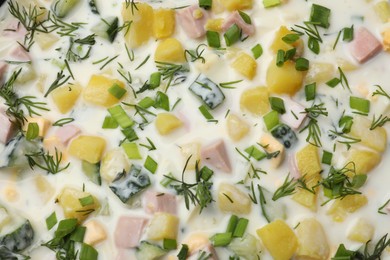 Photo of Delicious okroshka soup with kefir as background, top view