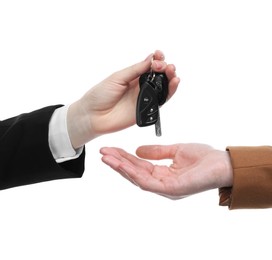 Photo of Dealer giving car keys to customer on white background, closeup. Buying auto