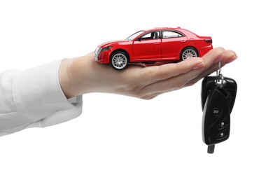 Photo of Woman with car model and keys on white background, closeup. Buying auto