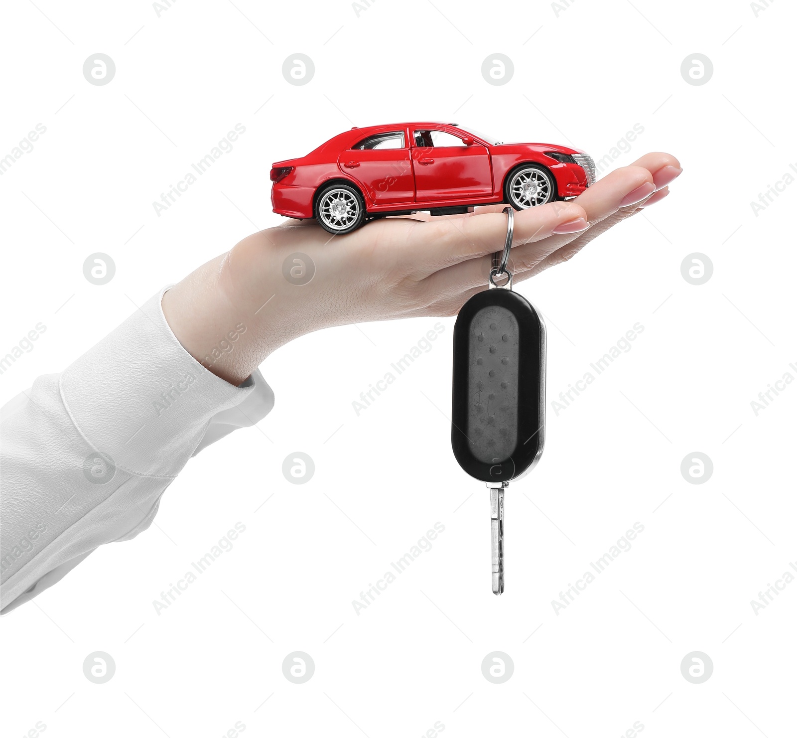 Photo of Woman with car model and key on white background, closeup. Buying auto