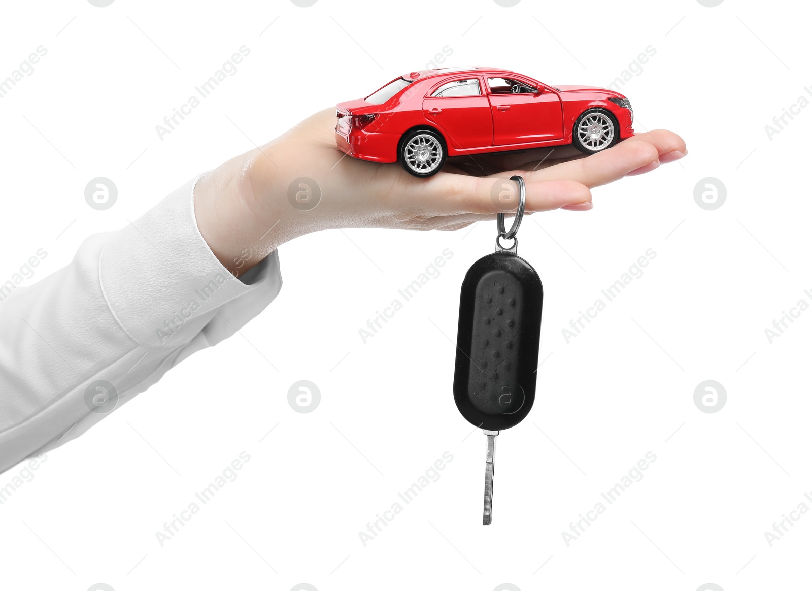 Photo of Woman with car model and key on white background, closeup. Buying auto