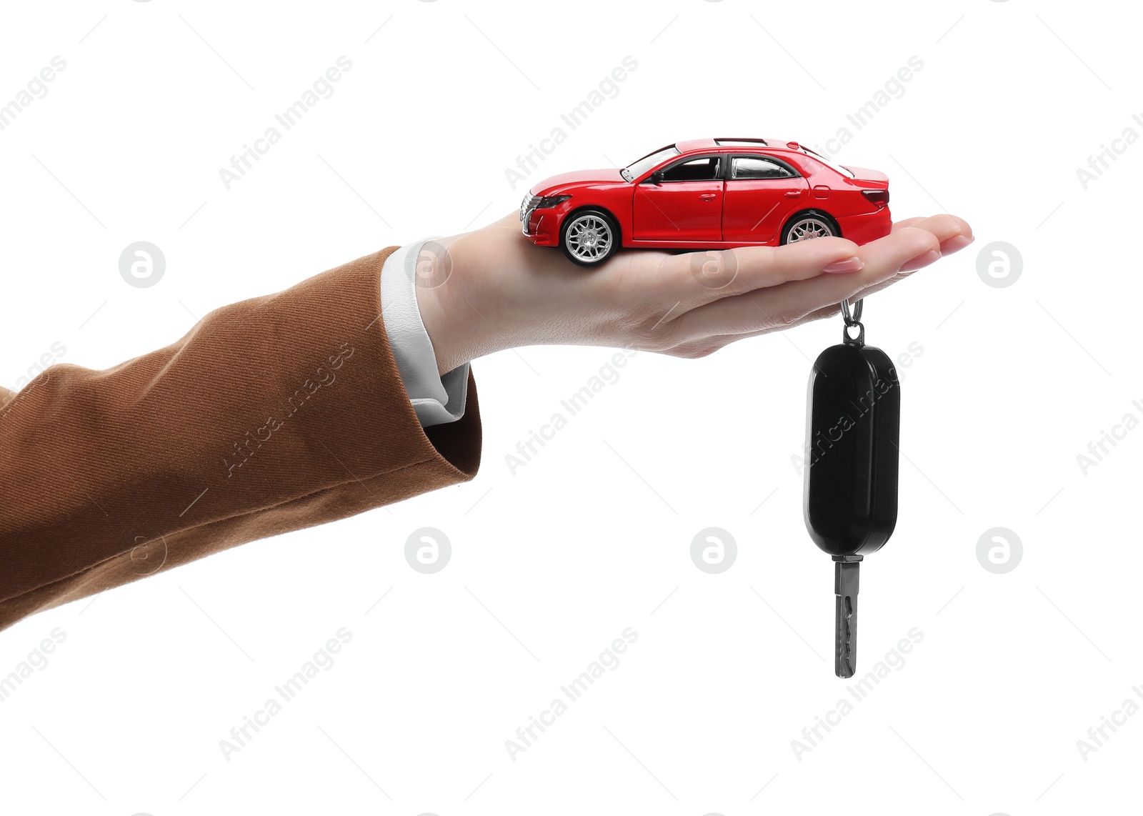 Photo of Woman with car model and key on white background, closeup. Buying auto