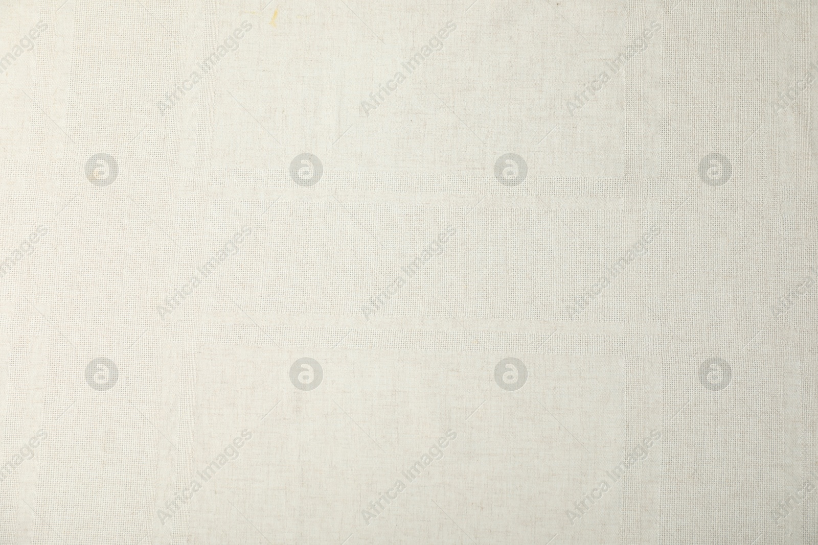 Photo of Texture of beige tablecloth as background, top view