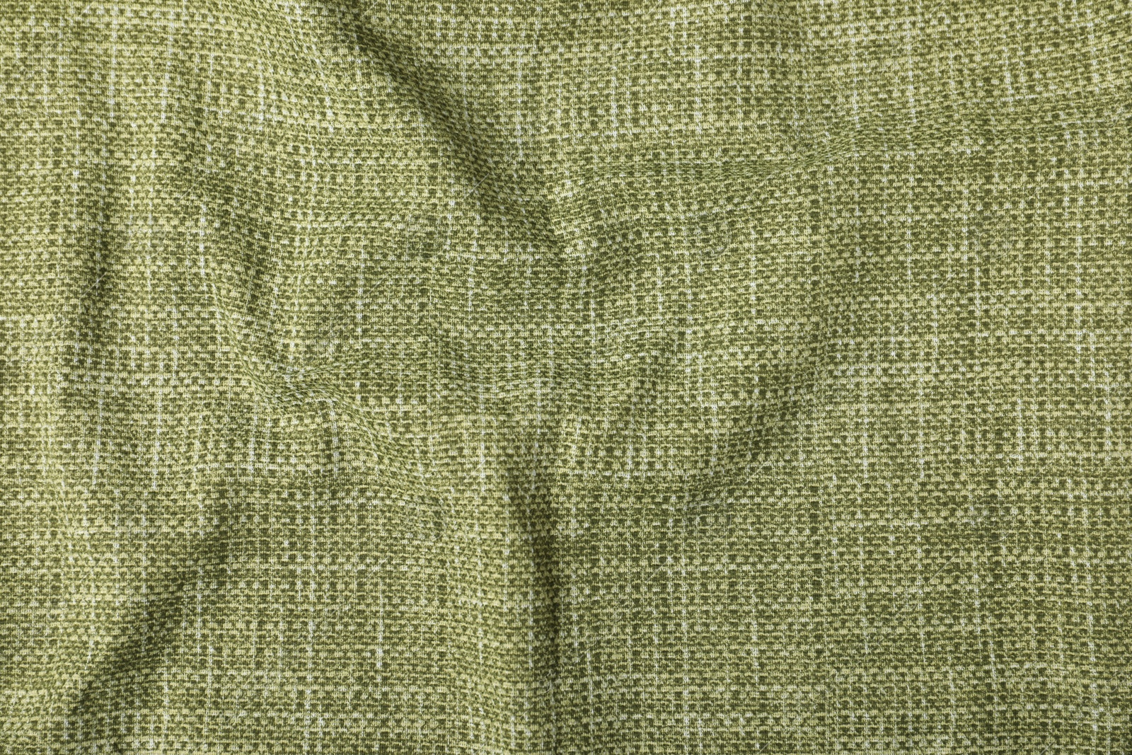 Photo of Texture of green crumpled tablecloth as background, top view