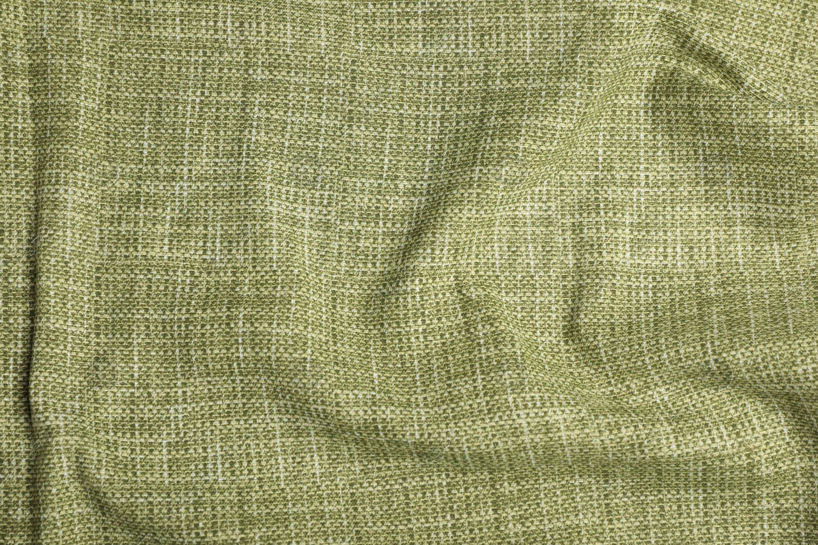 Photo of Texture of green crumpled tablecloth as background, top view