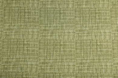 Photo of Texture of green tablecloth as background, top view