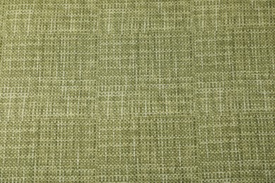 Photo of Texture of green tablecloth as background, top view