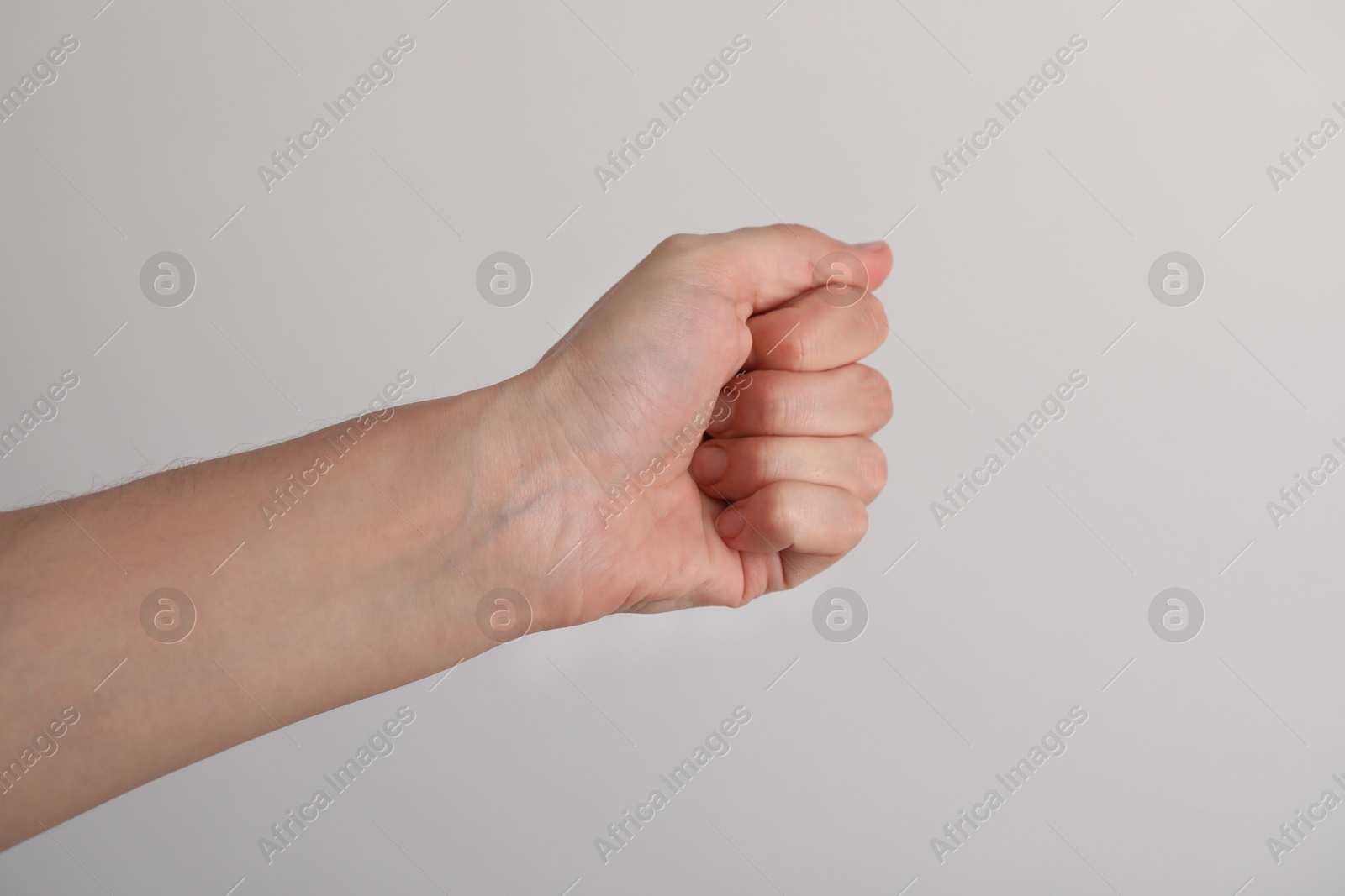 Photo of Woman with visible hand veins on light grey background, closeup. Space for text