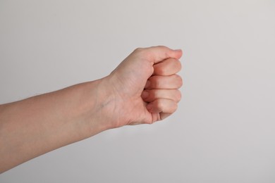 Photo of Woman with visible hand veins on light grey background, closeup. Space for text