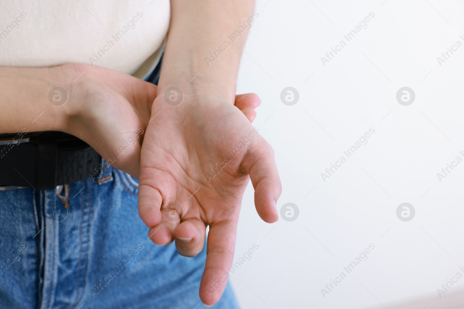 Photo of Woman with visible hand veins on white background, closeup. Space for text