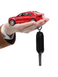 Photo of Woman with car model and key on white background, closeup. Buying auto